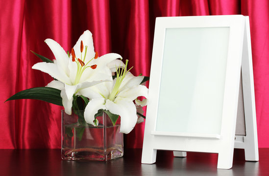 White photo frame for home decoration on curtains background