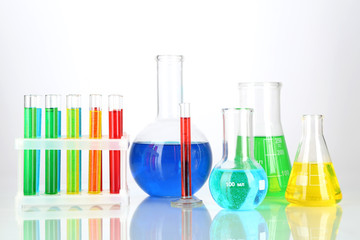 Test tubes with colorful liquids isolated on white