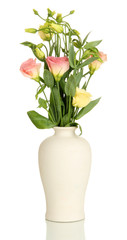 Bouquet of eustoma flowers in vase isolated on white