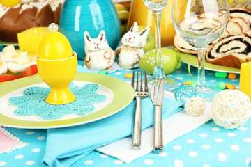 Serving Easter table with tasty dishes close-up