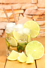 Glass of cocktail with lime and mint