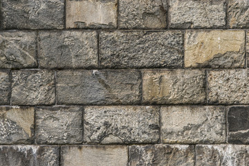 Solid stone block wall