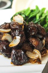 black pepper beef on white plate