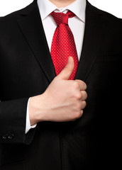 Isolated businessman in a suit with a red tie shows well