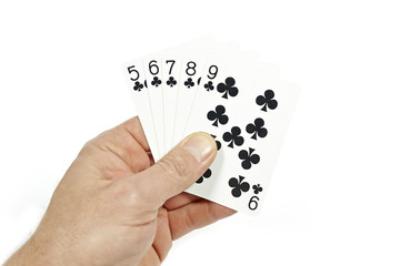 Poker player holding straight flush
