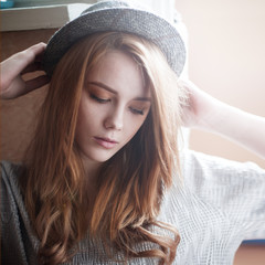 face of a beautiful blonde in a hat