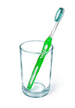 Toothbrushes in a glass. Isolated on white background