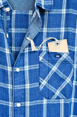 Blue checked shirt with price tag