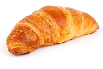 Fresh and tasty croissant over white background