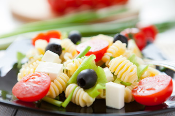 cooked macaroni with vegetables and feta
