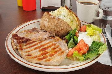 Grilled pork chops with a baked potato