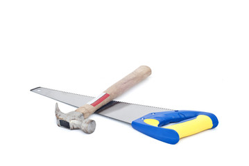 Handsaw and hammer on white background