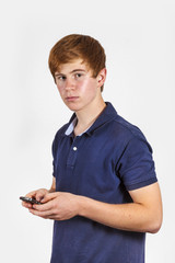 cute handsome boy dialing with his mobile