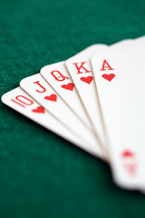 Straight royal flush playing cards, poker hand in hearts