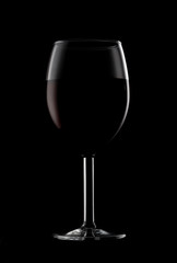 One glassed of red wine isolated on black background