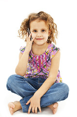 Cute little girl is talking on cell phone