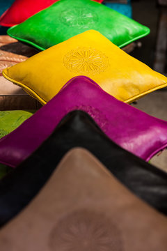 A line up of colorful pillows