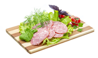 Sausages with salad and basil