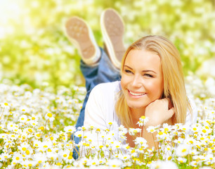 Female on chamomile field