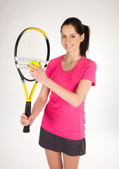Portrait of young woman with tennis racket