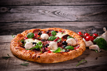Delicious italian pizza served on wooden table