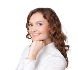 Portrait of pretty young businesswoman with hand on chin and smi