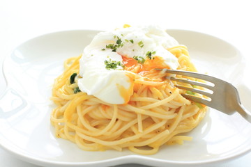 italian cuisine, poached egg on carbonara spaghetti