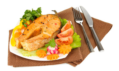 Appetizing grilled salmon with lemon and vegetables isolated