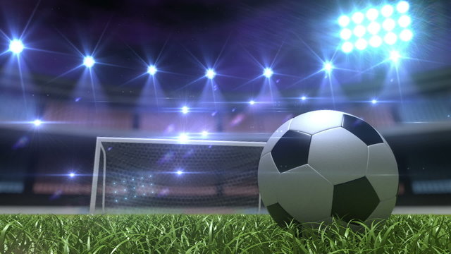 Football background, soccer ball on the grass at night stadium