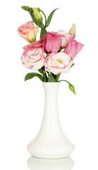 Bouquet of eustoma flowers in vase isolated on white
