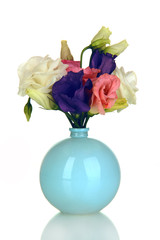 Bouquet of eustoma flowers in vase isolated on white