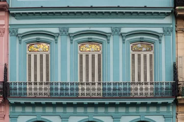 Zelfklevend Fotobehang Blue facade of colonial building © Maroš Markovič