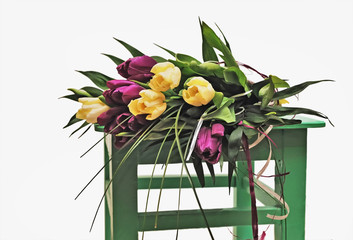 Tulip bouquet on a green chair
