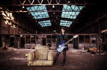 Naklejka na ściany i meble Guitarist on abandoned building