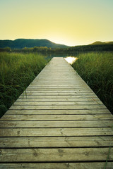 Sunset on the wooden pier of Lake Banyoles