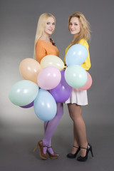 Fototapeta premium two teenage girls with balloons