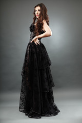 Fototapeta premium Elegant brunette girl in full length