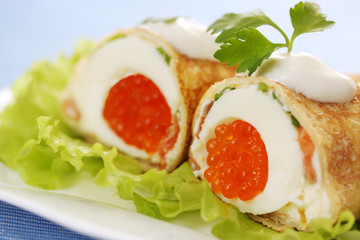 pancake with egg and caviar