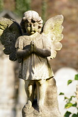 Cupid angel carved stone at cemetery
