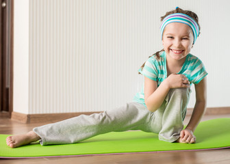 little girl doing gymnastic exercises