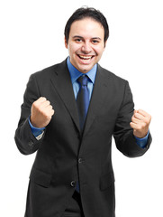 Business man throwing fists in air and smiling