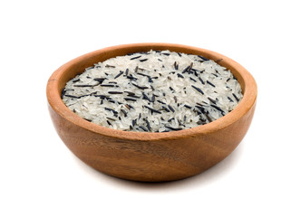 Wild rice and the white rice in a wooden bowl isolated