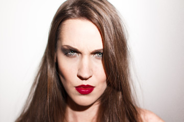 Fototapeta premium Attractive brunette woman angry portrait
