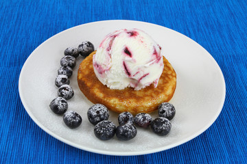 American pancake with ice cream and blueberries