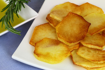 Fried potatoes, olive oil and rosemary