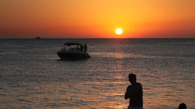 Posing Guy in the shadows in front of the balearic sunset 