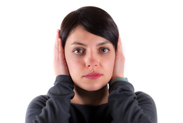 Casual brunette showing silence gesture on white background