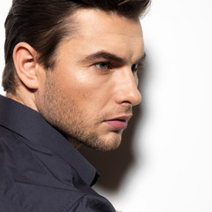 Fashion portrait of young man in black shirt