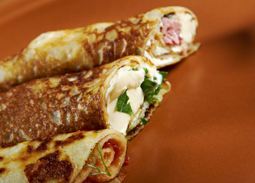 rolled pancakes stuffed ham and cheese.