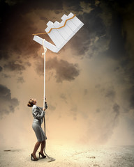 Image of businesswoman climbing the rope